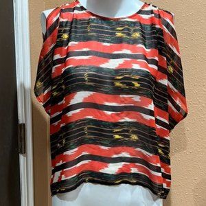 orange patterned cold shoulder blouse